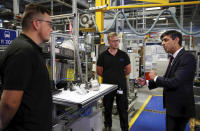 Britain's Chancellor of the Exchequer Rishi Sunak talks with employees during a visit to Worcester Bosch factory to promote the initiative, Plan for Jobs, in Worcester, England, Thursday July 9, 2020. (Phil Noble/Pool via AP)