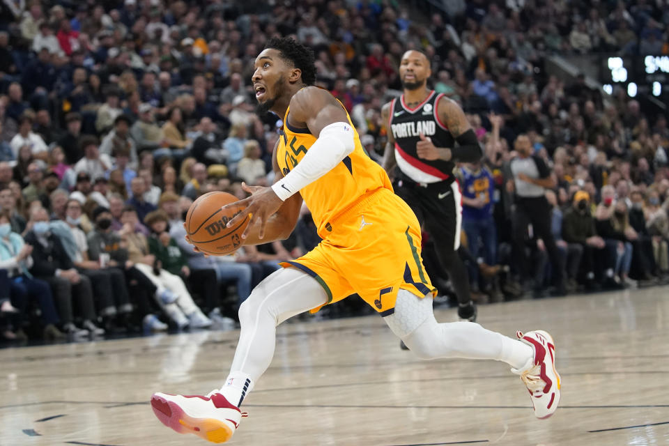 Utah Jazz guard Donovan Mitchell drives to the basket in the second half during an NBA basketball game against the Portland Trail Blazers Monday, Nov. 29, 2021, in Salt Lake City. (AP Photo/Rick Bowmer)