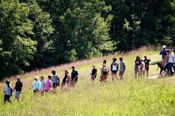 WINDER, GEORGIA - SEPTEMBER 4: Students wait to be picked up by their parents after a school shooting took place on September 4, 2024 in Winder, Georgia. Multiple fatalities and injuries have been reported and a suspect is in custody according to authorities.(Photo by Megan Varner/Getty Images)