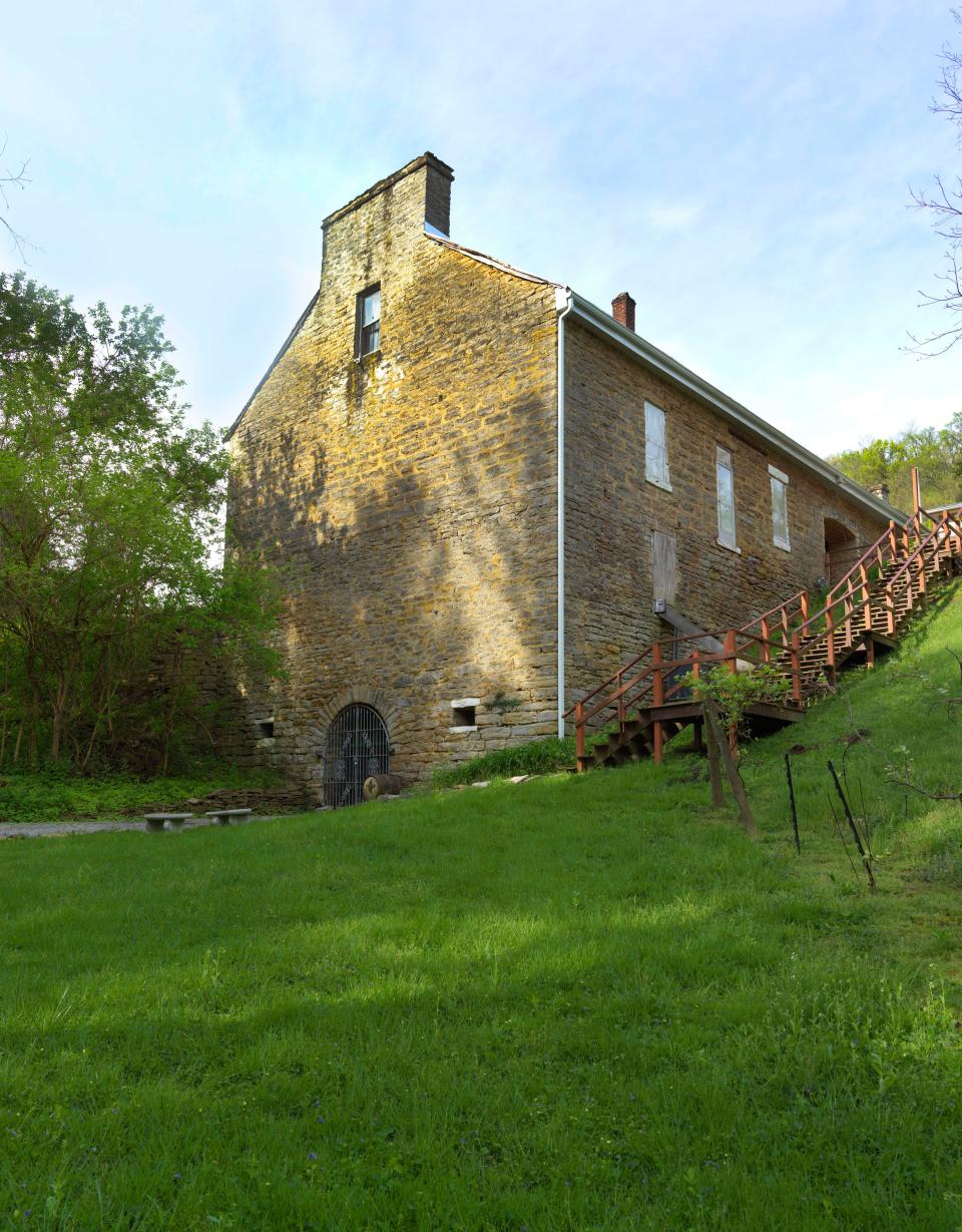 The Baker-Bird Winery in Augusta, Kentucky, is home to the oldest, largest wine cellar in this country. In this photo you can see the entrance to the cellar at the base of the building. The wine cellar is 40 feet wide, 40 feet tall and 90 feet deep.