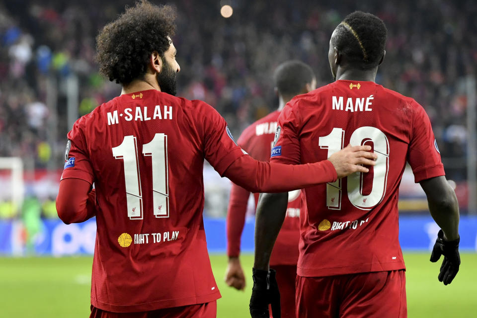 Liverpool's Mohamed Salah, left, celebrates with Liverpool's Naby Keita after scoring his side's second goal during the group E Champions League soccer match between Salzburg and Liverpool, in Salzburg, Austria, Tuesday, Dec. 10, 2019. (AP Photo/Kerstin Joensson)