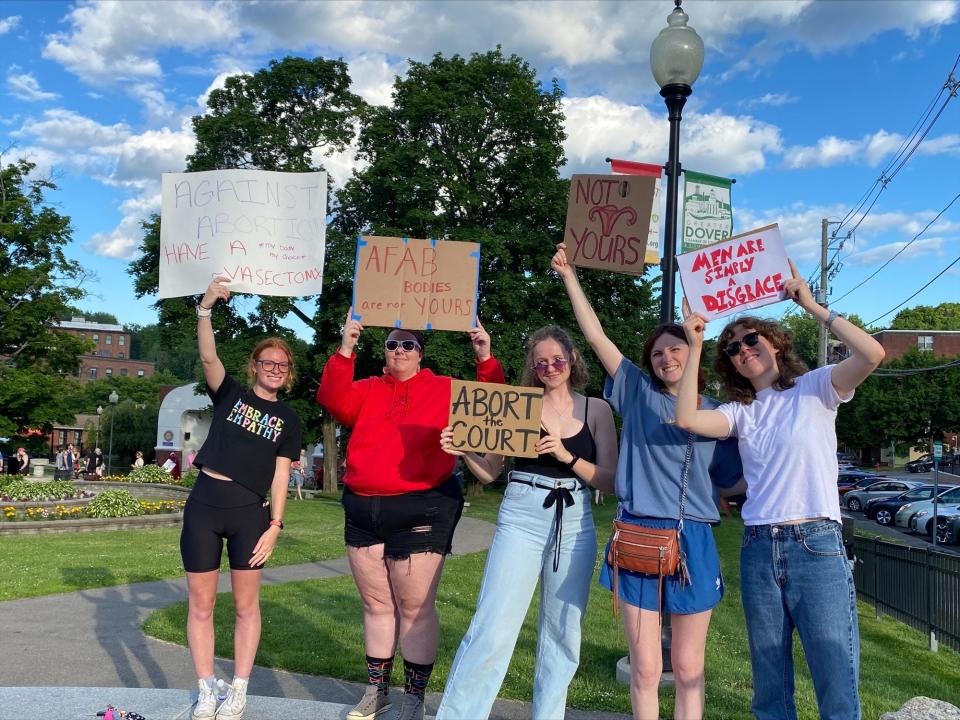 Ella Colwell, left, Kate Harvey, Audrey Hart, Bridget Widrig, and Kerry Hull participate in the "Bans Off Our Bodies" rally in Dover on Friday, June 24, 2022.