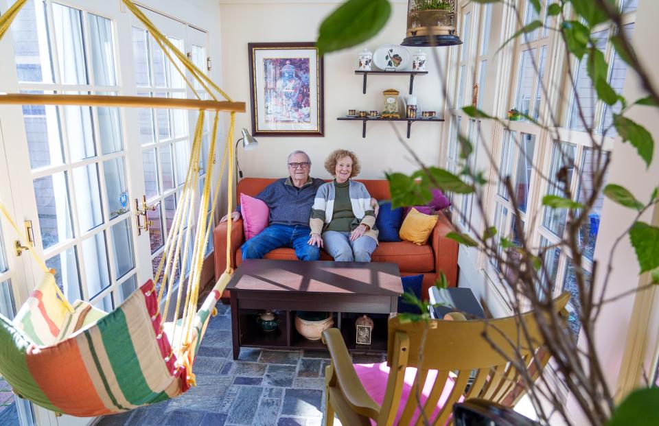 Bob and Helen Small pose Wednesday, March 15, 2023, for a portrait inside a tunnel turned sunroom at their home in the Lockerbie Square neighborhood in Indianapolis.