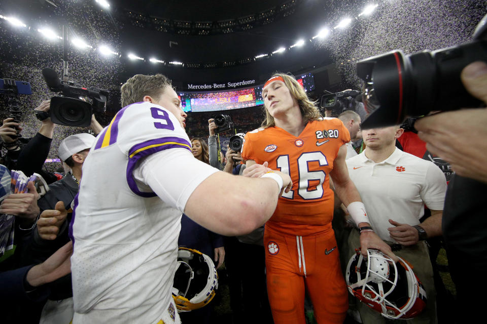 NEW ORLEANS, LOUISIANA - JANUARY 13: Joe Burrow #9 of the LSU Tigers talks with Trevor Lawrence #16 of the Clemson Tigers after their 42-25 win over Clemson Tigers in the College Football Playoff National Championship game at Mercedes Benz Superdome on January 13, 2020 in New Orleans, Louisiana. (Photo by Chris Graythen/Getty Images)