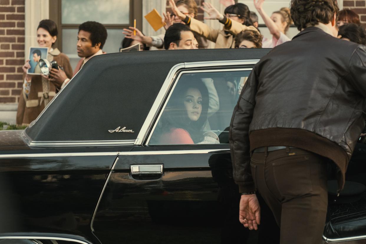 Cailee Spaeny as Priscilla Presley looking out a car window