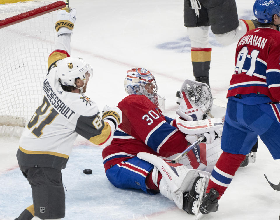 Vegas Golden Knights' Jonathan Marchessault (81) celebrates a goal by Brayden McNabb, not seen, as Montreal Canadiens goaltender Cayden Primeau (30) sits on the ice during the second period of an NHL hockey game Thursday, Nov. 16, 2023, in Montreal. (Christinne Muschi/The Canadian Press via AP)