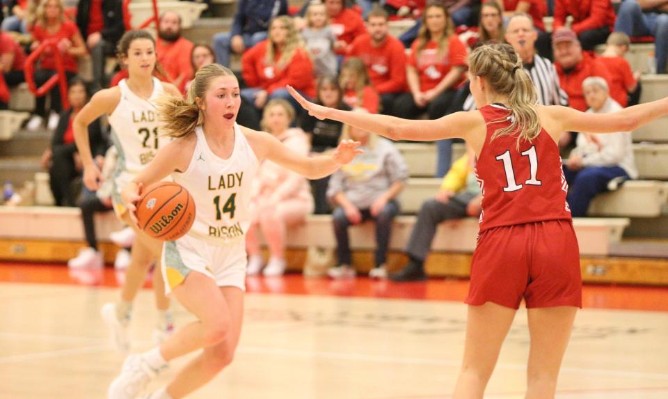 Benton Central junior Avery Hardebeck (left) attacks the basket while defended by Twin Lakes junior Addie Bowsman during the IHSAA Class 3A semifinals at Kent Adams Court on Friday, Feb. 3, 2024.