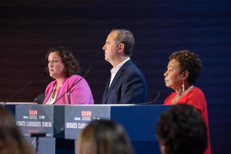Reps. Katie Porter, Adam B. Schiff and Barbara Lee standing at lecterns during a debate
