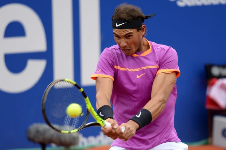 Spanish tennis player Rafael Nadal returns the ball to South African tennis player Kevin Anderson in Barcelona on April 27, 2017