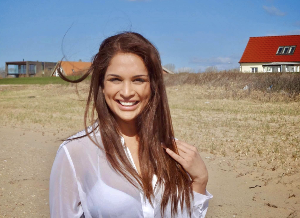 Pictured is Miriam Rivera smiling to the camera. 