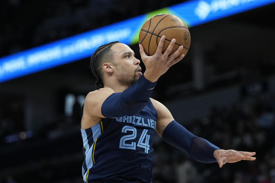 Memphis Grizzlies forward Dillon Brooks (24) goes up for a shot during the first half of an NBA basketball game against the Minnesota Timberwolves, Friday, Jan. 27, 2023, in Minneapolis. (AP Photo/Abbie Parr)