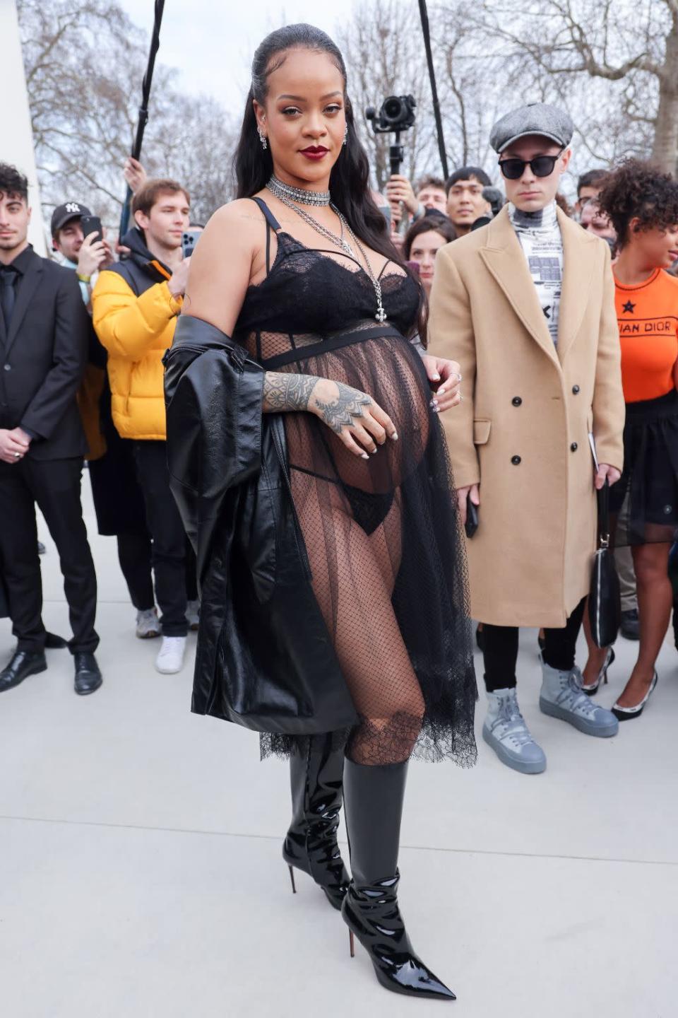 Rihanna arrives the the Dior Womenswear Fall/Winter 2022/2023 show on March 1 in custom Amina Muaddi boots. - Credit: SplashNews.com