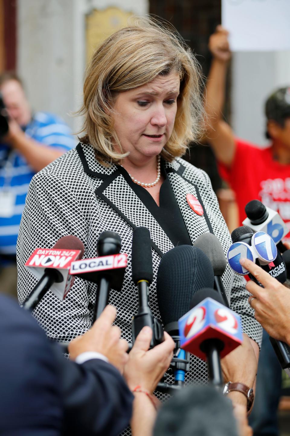 Dayton mayor Nan Whaley gives a brief press conference in front of Ned Pepper's Bar in the Oregon District of Dayton, Ohio, on Tuesday, Aug. 6, 2019.