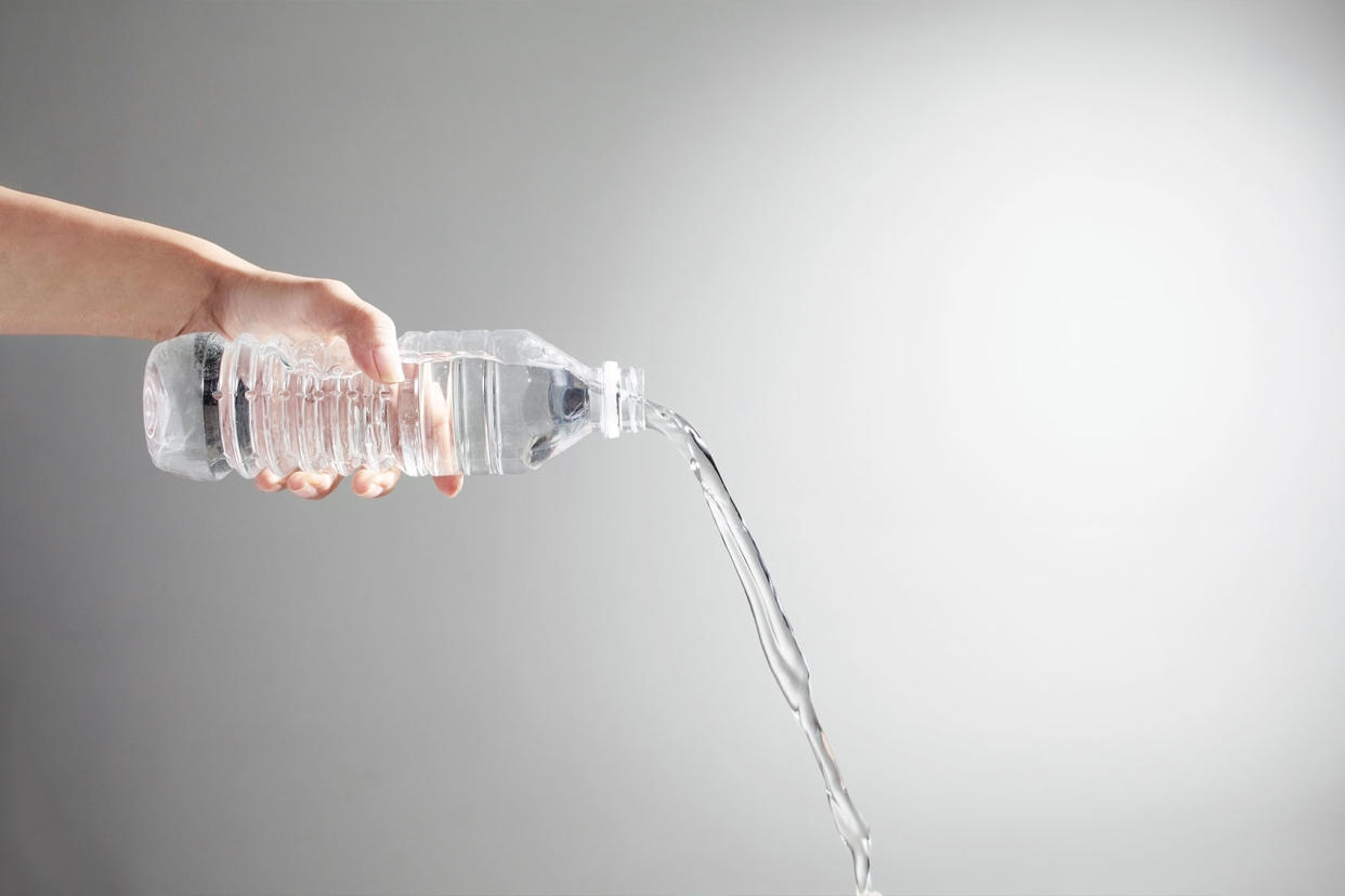 Pouring water from bottle Getty Images/RunPhoto