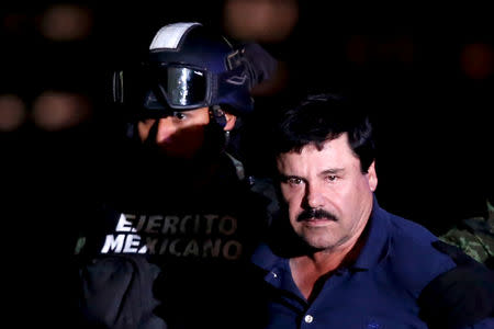 FILE PHOTO: Joaquin "El Chapo" Guzman is escorted by soldiers during a presentation at the hangar belonging to the office of the Attorney General in Mexico City, Mexico January 8, 2016. REUTERS/Edgard Garrido/File Photo