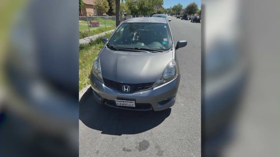 A Honda Fit damaged by the suspect in Burbank. (KTLA)