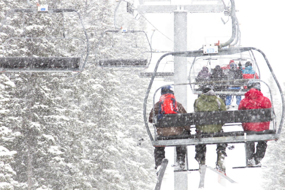 The original Sublette Lift ferries skiers uphill during a snowstorm.<p>Courtesy Jackson Hole Mountain Resort</p>