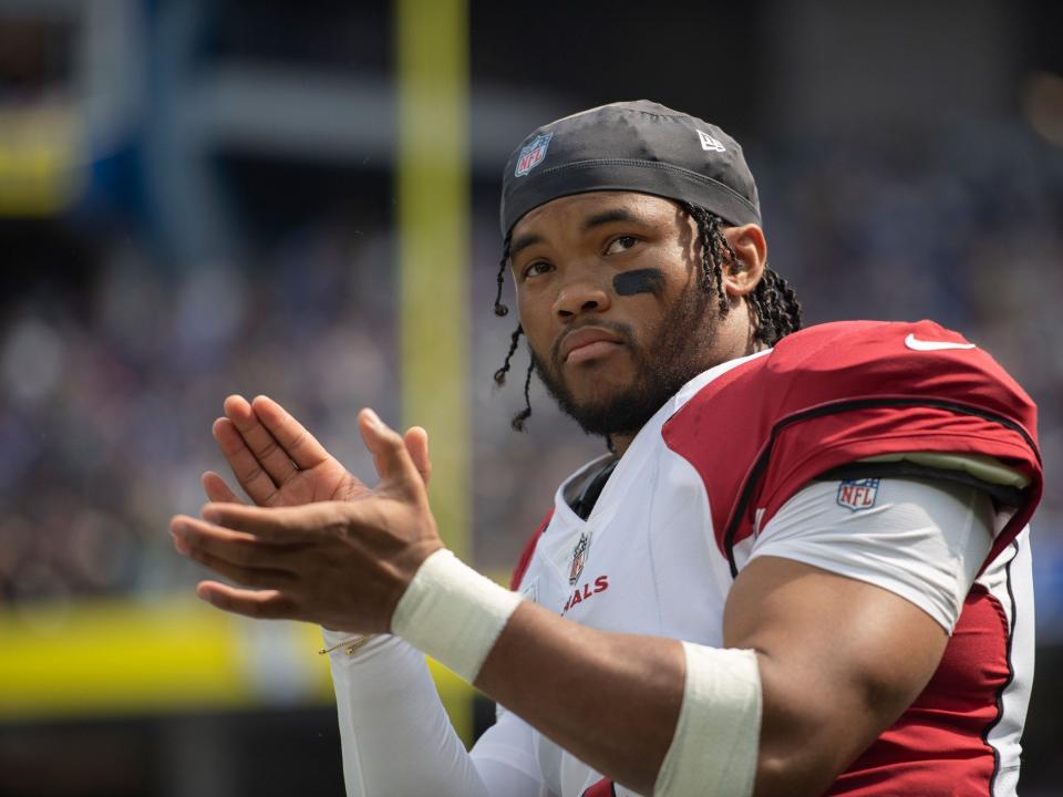 Kyler Murray applauds before a game against the Los Angeles Rams.