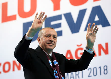 Turkish President Tayyip Erdogan greets his supporters during a meeting of his ruling AK Party in Trabzon, Turkey March 25, 2018. Murat Cetinmuhurdar/Presidential Palace/Handout via REUTERS