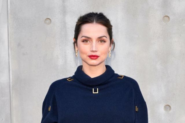 Ana de Armas is Preppy-Chic in Sweater, Velvet Mini Skirt & Knee-High Boots  at Louis Vuitton Cruise 2023 Show