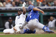 Detroit Tigers left fielder Akil Baddoo slides safely into home plate to score ahead of the tag by Kansas City Royals catcher MJ Melendez (1) in the fifth inning of a baseball game in Detroit, Thursday, Sept. 29, 2022. (AP Photo/Paul Sancya)