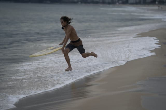 A surfer on Ipanema Beach in Rio