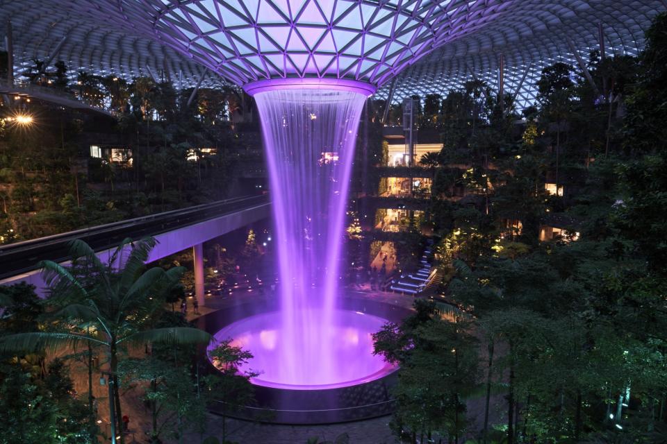 The Rain Vortex indoor waterfall feature at Jewel Changi Airport mall in Singapore. Photographer: Lauryn Ishak/Bloomberg