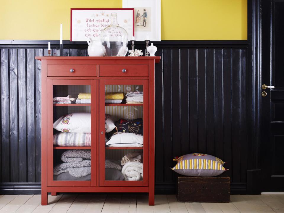 In this publicity product photo provided by Ikea (www.ikea.com) the Hemnes cabinet in red is a good example of simple Swedish furniture design rendered in an organic hue. (AP Photo/Ikea)