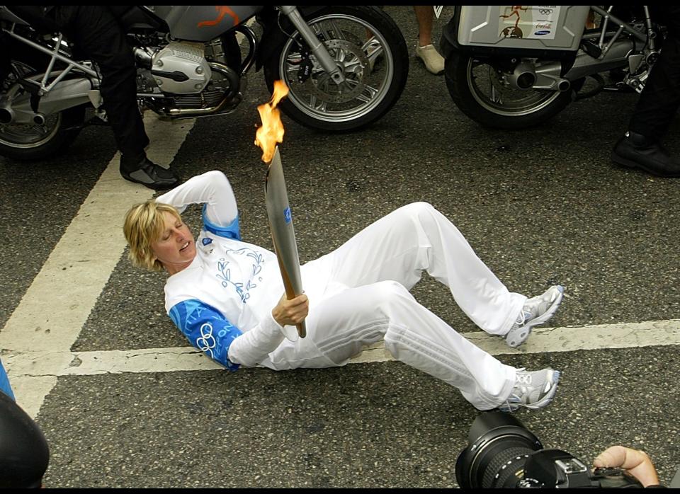 Sit-ups while holding the Olympic torch? What a woman!  