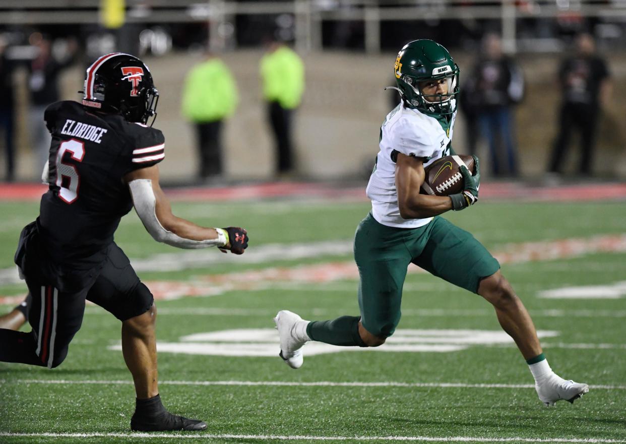 Baylor's wide receiver Jordan Nabors (18), right, runs with the ball against Texas Tech, Saturday, Oct. 29, 2022, at Jones AT&T Stadium. 