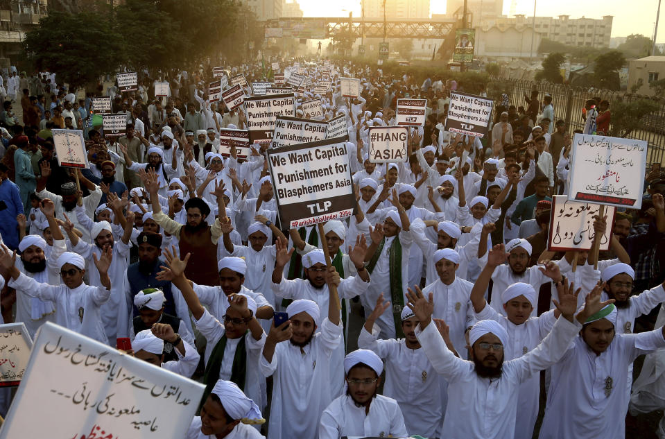 FILE - In this Nov. 21, 2018 file photo, Pakistani religious students rally for the implementation of a blasphemy law and against the acquittal of Aasia Bibi, in Karachi, Pakistan. In Mid January 2019, Bibi, a Pakistani Christian woman, still lives the life of a prisoner, although she was freed from death row by the country’s top court more than two months ago. Meanwhile, a petition by Islamist radicals who rallied against her acquittal of blasphemy charges and who seek her execution awaits a Supreme Court decision. (AP Photo/Shakil Adil, File)