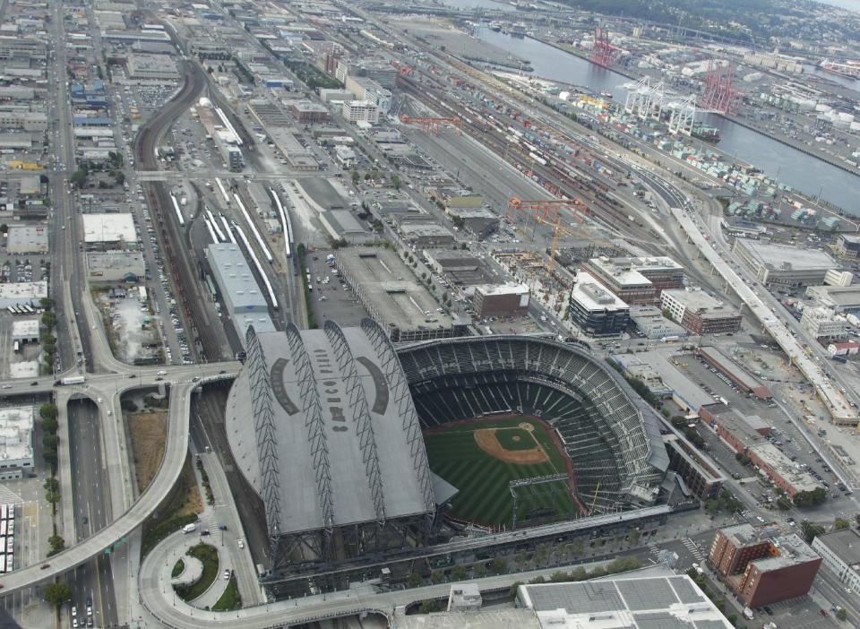 In this aerial photo taken Aug. 21, 2012, Safeco Field is shown near downtown Seattle and the Port of Seattle. A new arena in Seattle that would be built just south of Safeco Field and that could bring NBA basketball back to the city appeared a step closer to reality as Seattle Mayor Mike McGinn issued a statement late Monday, Sept. 10, 2012, saying he welcomes the news that the Seattle City Council has decided to support bringing basketball back to Seattle. (AP Photo/Ted S. Warren)