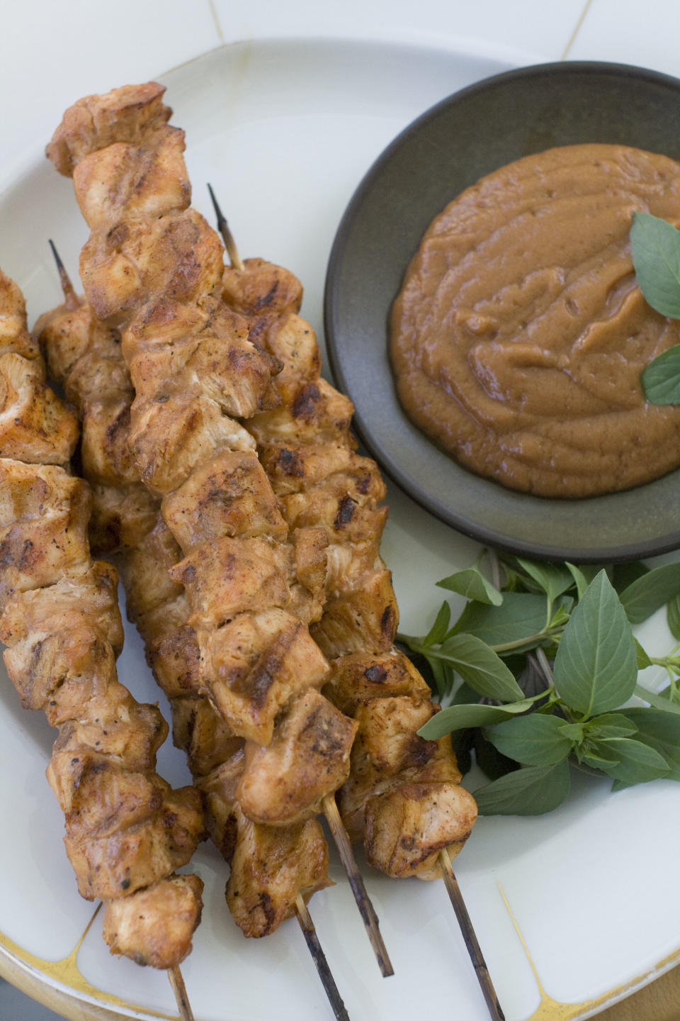 In this Aug. 5, 2013 photo, chicken kebabs with chili banana sauce are shown, in Concord, N.H. (AP Photo/Matthew Mead)