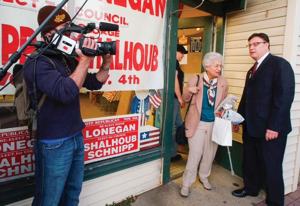 Steve Lonegan, right, mayor of Bogota, N.J., is filmed for a documentary, "Anytown USA," outside his campaign headquarters in Bogota, N.J., on Oct. 30, 2003.