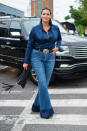 <p>Model Candice Huffine wears a<a rel="nofollow noopener" href="https://11honore.com/products/brandon-maxwell-navy-rolled-collar-satin-shirt" target="_blank" data-ylk="slk:navy blouse;elm:context_link;itc:0;sec:content-canvas" class="link "> navy blouse</a> and<a rel="nofollow noopener" href="https://11honore.com/products/brandon-maxwell-blue-bell-bottom-denim" target="_blank" data-ylk="slk:jeans;elm:context_link;itc:0;sec:content-canvas" class="link "> jeans</a> by Brandon Maxwell from 11 Honoré ahead of the designer’s NYFW show. (Photo: Getty) </p>