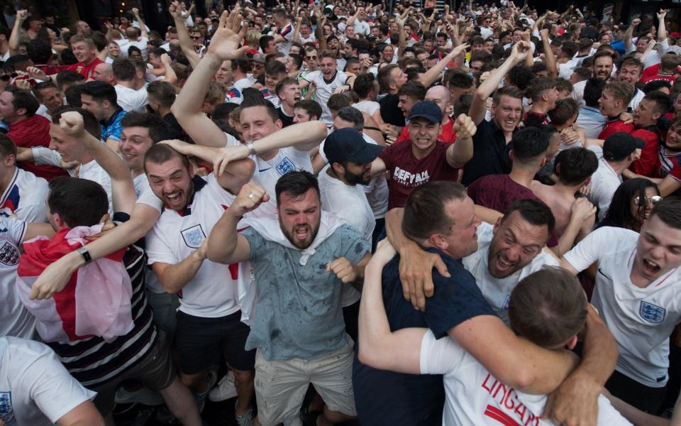 England football fans celebrate after England scored the first goal in the England v Sweden quarter final match in the FIFA 2018 World Cup Finals at Croydon Boxpark  - Getty Images