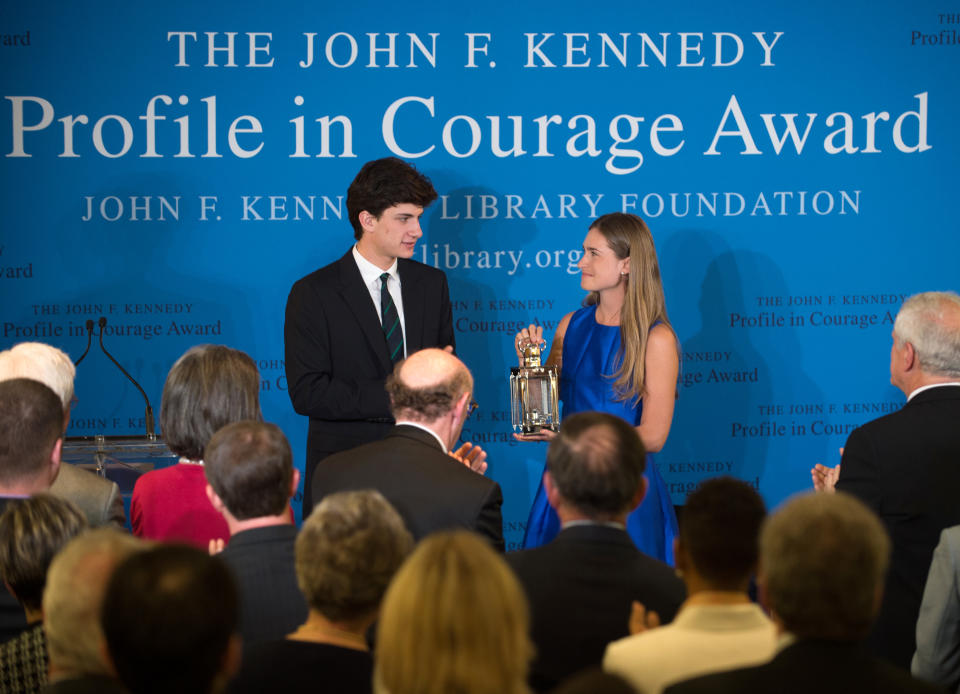 Lauren Bush Lauren, right, granddaughter of Former President George H.W. Bush, accepts the 2014 John F. Kennedy Profile in Courage Award on behalf of her grandfather from Jack Schlossberg, left, grandson of President John F. Kennedy, during a ceremony at the John F. Kennedy Library and Museum, Sunday, May 4, 2014, in Boston. (AP Photo/Gretchen Ertl)