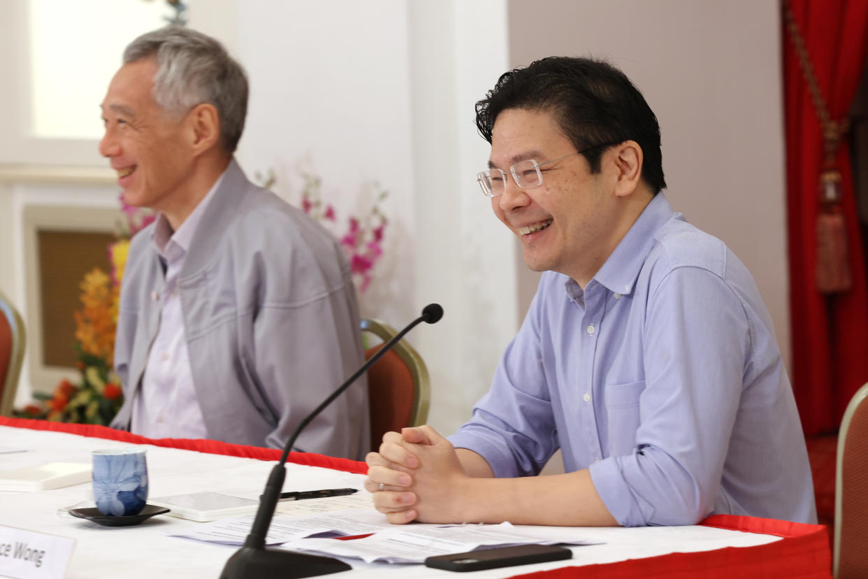 Prime Minister Lee Hsien Loong (left) and Finance Minister Lawrence Wong during a media conference on 16 April 2022.