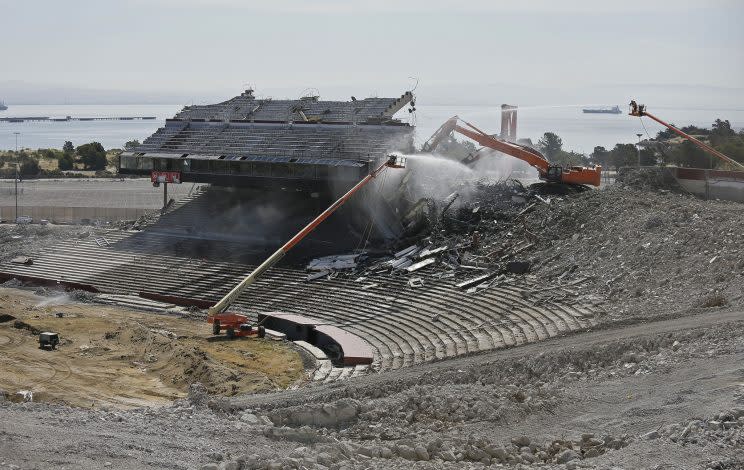 Crews continue work on the demolition of Candlestick Park, Tuesday, June 30, 2015, in San Francisco. Very little remains of the park which was home to the San Francisco Giants baseball team and San Francisco 49ers NFL football team. Developers plan for houses, a hotel and a shopping center to be built on the site of the 