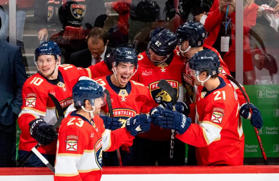 Florida Panthers center <a class="link " href="https://sports.yahoo.com/nhl/players/6062/" data-i13n="sec:content-canvas;subsec:anchor_text;elm:context_link" data-ylk="slk:Carter Verhaeghe;sec:content-canvas;subsec:anchor_text;elm:context_link;itc:0">Carter Verhaeghe</a> (23) highfives Florida Panthers center <a class="link " href="https://sports.yahoo.com/nhl/players/6726/" data-i13n="sec:content-canvas;subsec:anchor_text;elm:context_link" data-ylk="slk:Evan Rodrigues;sec:content-canvas;subsec:anchor_text;elm:context_link;itc:0">Evan Rodrigues</a> (17) and other teammates after scoring a goal during the third period of Game 5 of Round 1 of the Stanley Cup Playoffs on Monday, April 29, 2024, at Amerant Bank Arena in Sunrise, Fla. The Florida Panthers won 6-1 and won the series. Alie Skowronski/askowronski@miamiherald.com