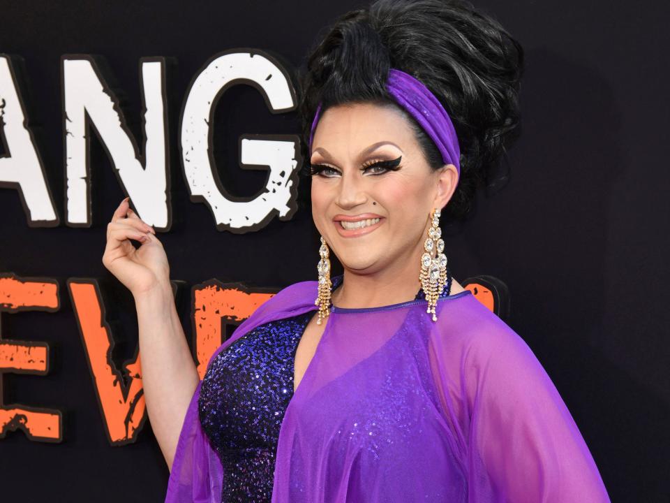 BenDeLaCreme in purple gown with sheer shawl