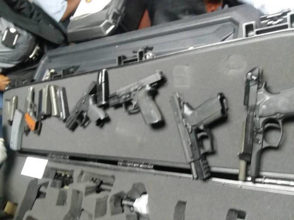 This photo of the weapons brought into Haiti by Jacques Yves Duroseau was circulated on social media after Duroseau’s arrest in Port-au-Prince Tuesday after arriving aboard an American Airlines flight from Miami. Two police officials confirmed that the photos are from the incident.