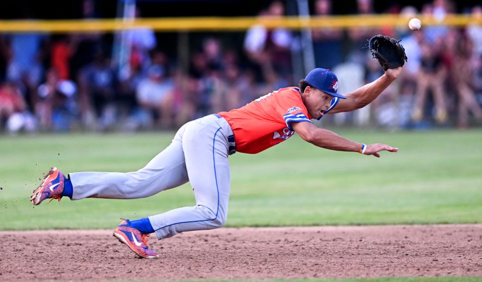 The ball hit by Jack Penney of Orleans takes a jump on Hyannis third baseman Cam Smith of Florida St. in the Cape League All Star game.