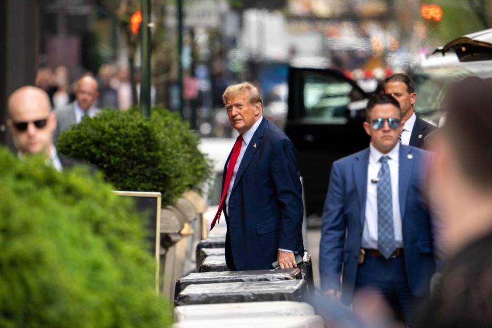 <div class="inline-image__caption"><p>Donald Trump arrives back to Trump Tower after the first day of his trial.</p></div> <div class="inline-image__credit">Adam Gray/AFP via Getty</div>