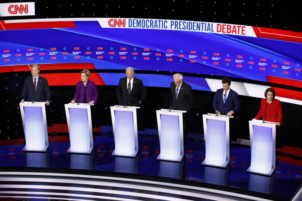 Sen. Amy Klobuchar, D-Minn., right speaks as from left, Democratic presidential candidates businessman Tom Steyer, Sen. Elizabeth Warren, D-Mass., former Vice President Joe Biden, Sen. Bernie Sanders, I-Vt., and former South Bend Mayor Pete Buttigieg listen Tuesday, Jan. 14, 2020, before a Democratic presidential primary debate hosted by CNN and the Des Moines Register in Des Moines, Iowa. (AP Photo/Patrick Semansky)