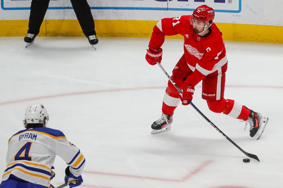 Detroit Red Wings center Dylan Larkin (71) shoots the puck against Buffalo Sabres during the first period at Little Caesars Arena in Detroit on Sunday, April 7, 2024.