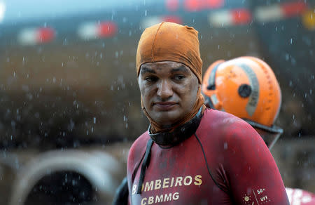 FILE PHOTO: A member of rescue team is seen, upon returning from the mission, after a tailings dam owned by Brazilian mining company Vale SA collapsed, in Brumadinho, Brazil February 13, 2019. REUTERS/Washington Alves/File Photo