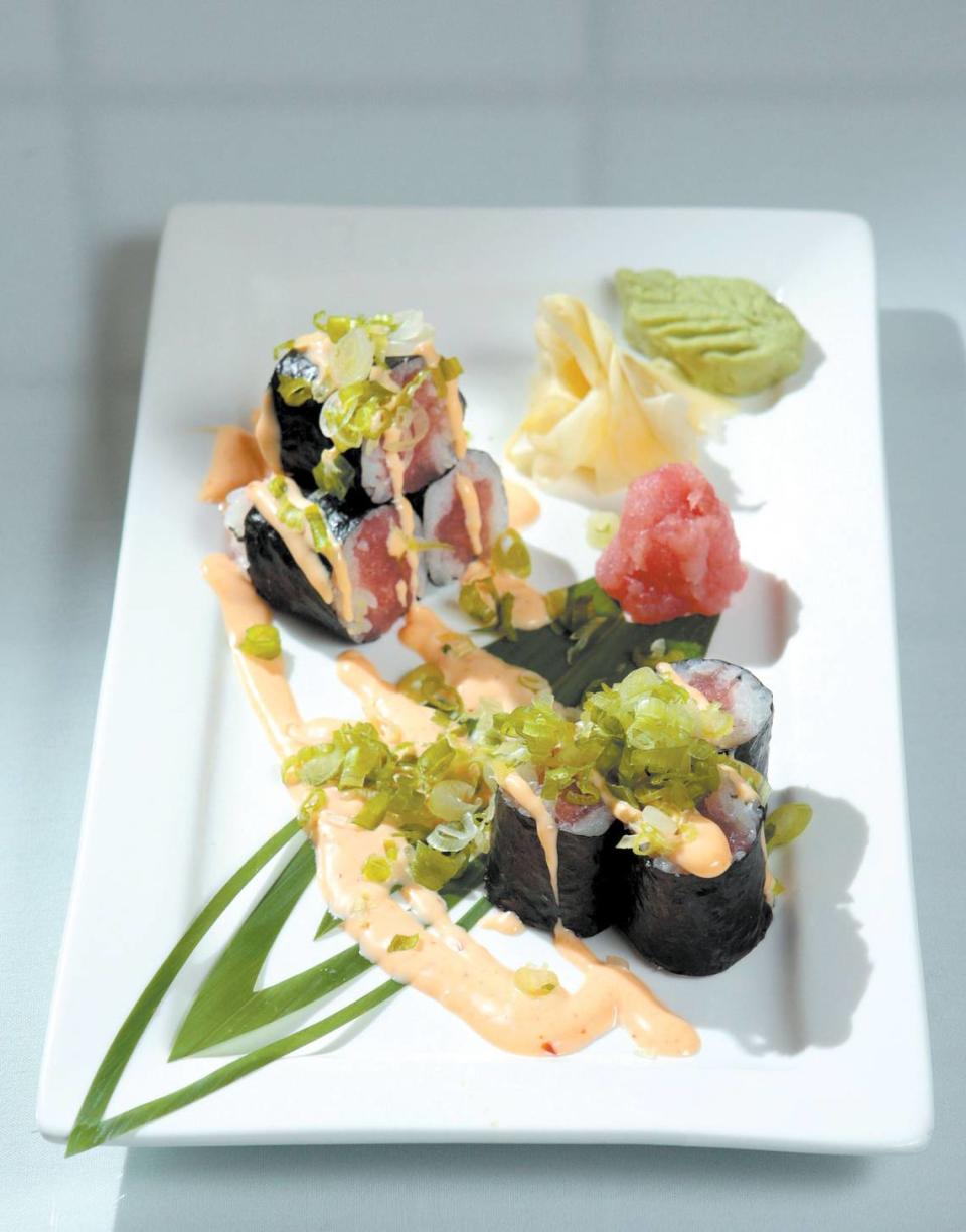 From top, menu options at Goshi Japanese Restaurant in Paso Robles include albacore tataki, crab roll with avocado and spicy tuna roll.