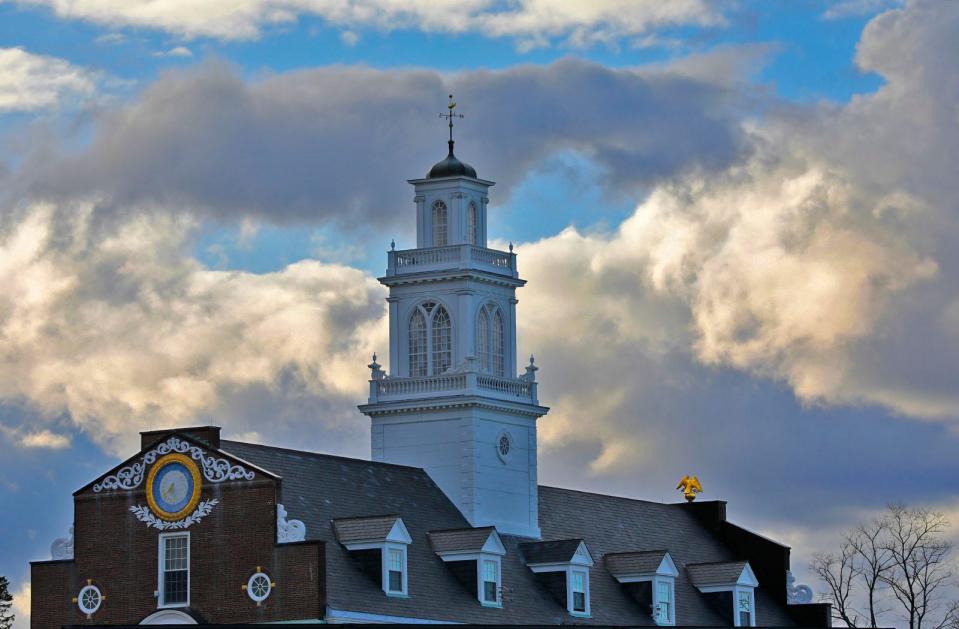 Late-afternoon clouds hover over Weymouth Town Hall on Friday, April 1, 2022.