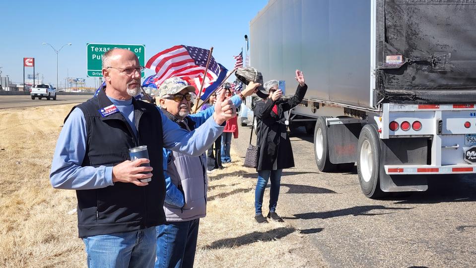 Texas State Senate District 31 candidate Tim Reid stands among the supporters of the "people's convoy "Saturday to show his support near the Starlight Ranch Amarillo.